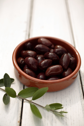 olives on a table with branch